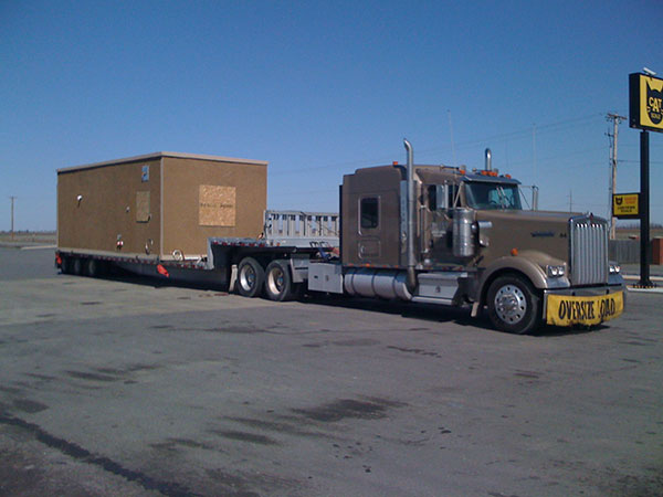 Utley Incorporated truck hauling trailer.